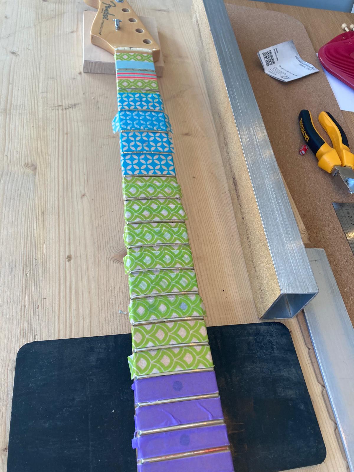 Bescherming van de toets voor leveling met fret level beam